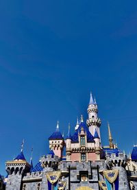 Low angle view of buildings against blue sky