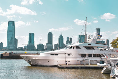 New jersey skyline from battery park in a sunny day. luxury yacht in the foreground. nyc