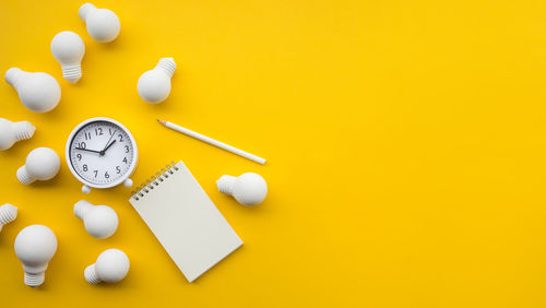 High angle view of clock on table