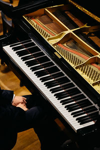 High angle view of man playing piano