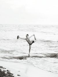 Woman standing on beach