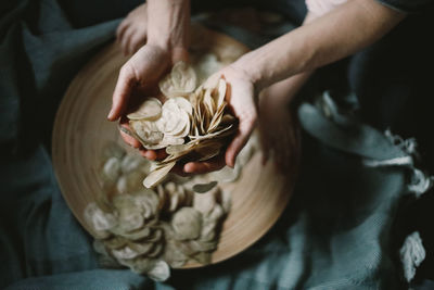 Midsection of person holding rose