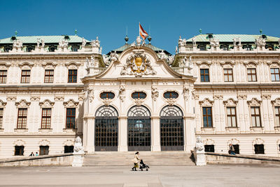 Facade of historic building against clear sky