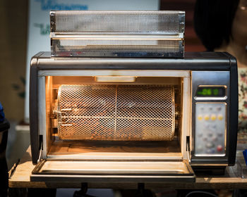 Close-up of old machine part on table