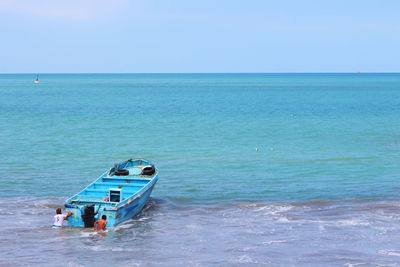 High angle view of boat in sea against sky