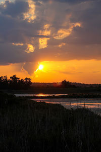 Scenic view of sunset over lake
