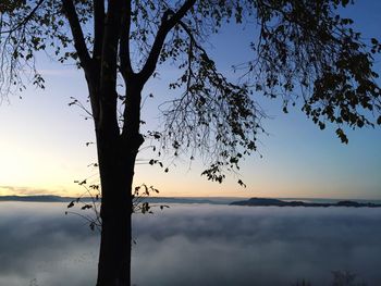 Scenic view of calm lake at sunset