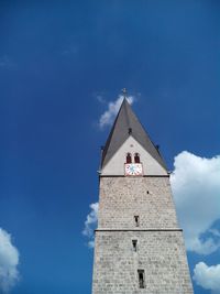 Low angle view of a bell tower against sky