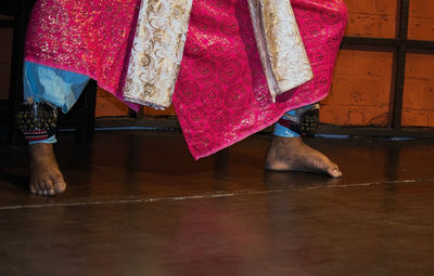 Low section of woman standing on floor