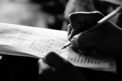 Cropped image of woman holding book