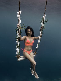 Full length of young woman in boat