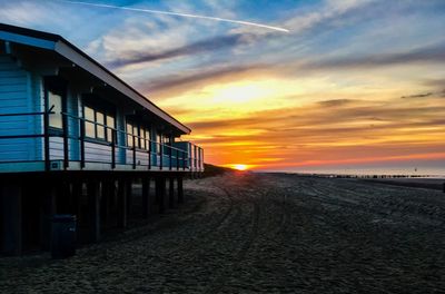 Scenic view of beach against sky during sunset
