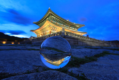 Traditional building against blue sky at night