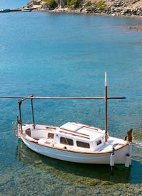 Sailboats moored on sea