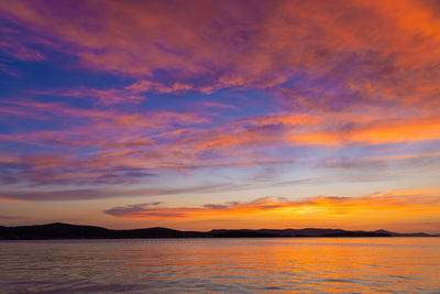 Sunset on the adriatic sea near krk island, croatia