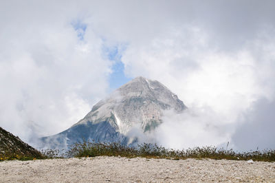 Scenic view of mountain against cloudy sky