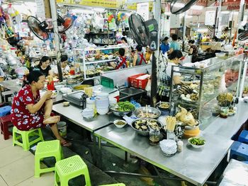 Group of people at market stall