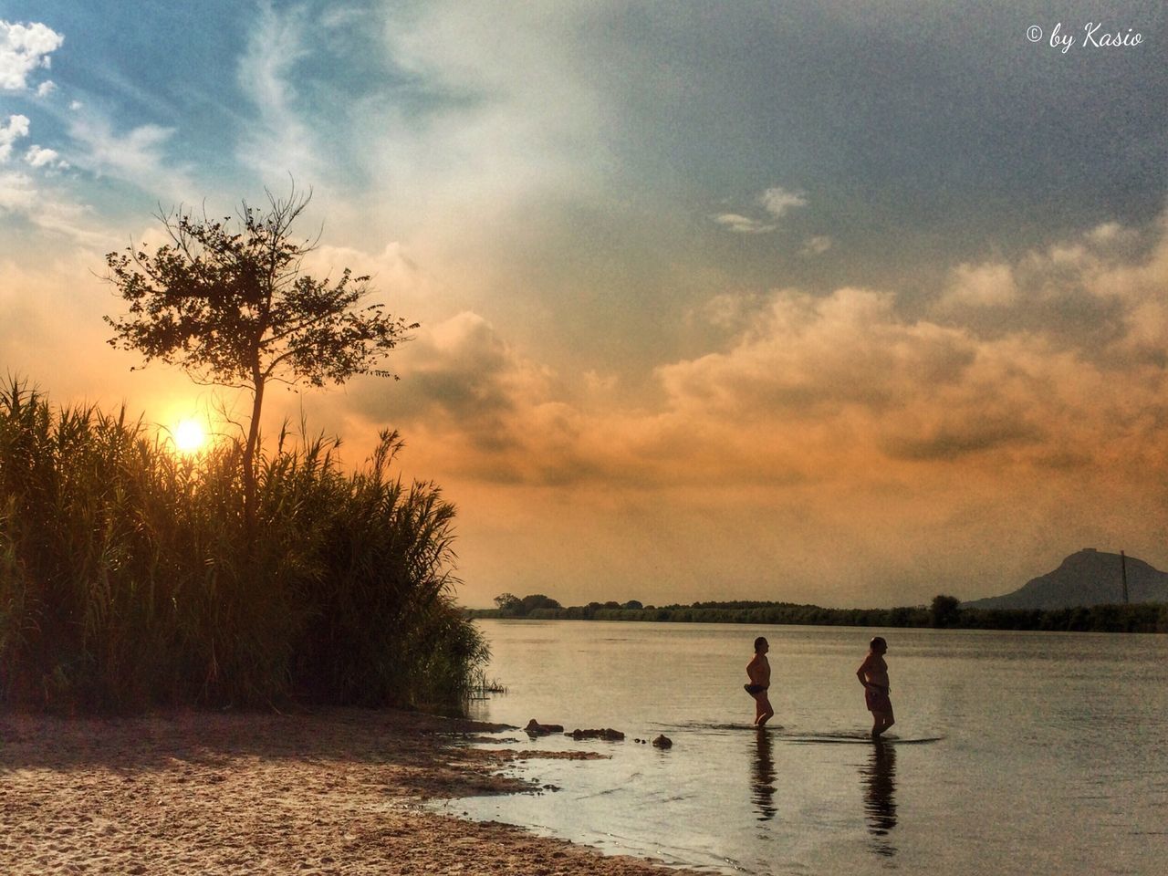 sunset, water, sky, sun, silhouette, tranquil scene, scenics, beauty in nature, tranquility, reflection, cloud - sky, lake, leisure activity, lifestyles, nature, tree, sunlight, men