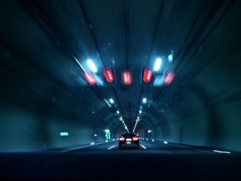 Close-up of illuminated car on road at night