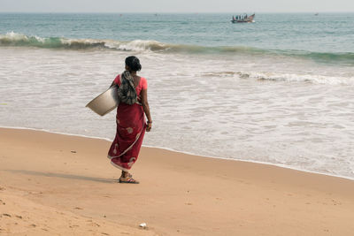 Rear view of woman on beach