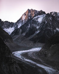 Scenic view of snowcapped mountains against clear sky