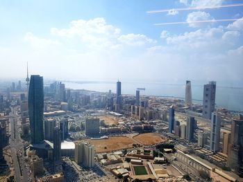 High angle view of modern buildings in city against sky