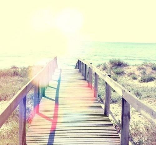 railing, sea, horizon over water, the way forward, tranquility, tranquil scene, water, scenics, sunlight, sky, beauty in nature, nature, clear sky, diminishing perspective, pier, sun, idyllic, wood - material, boardwalk, sunbeam