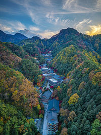 High angle view of trees and mountains against sky