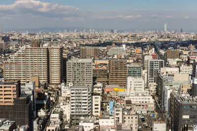 High angle view of buildings in city against sky