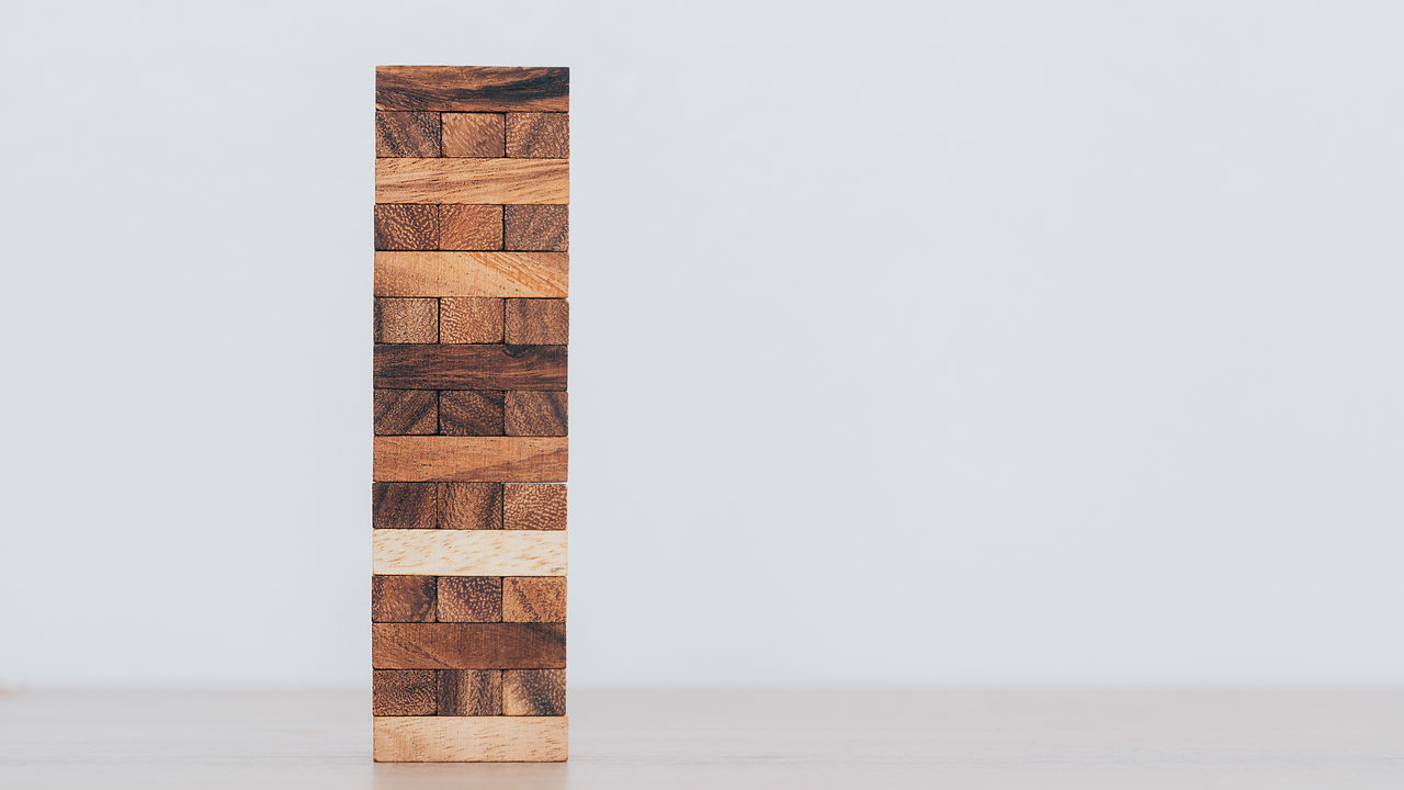 STACK OF TABLE AGAINST WALL