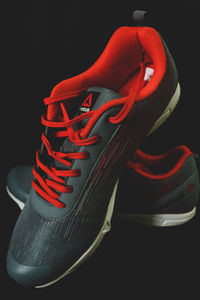 Close-up of shoes against black background