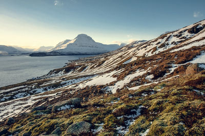 Snowy highland near northern sea landscape photo