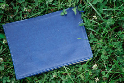 High angle view of open book on field