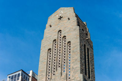 Low angle view of building against blue sky