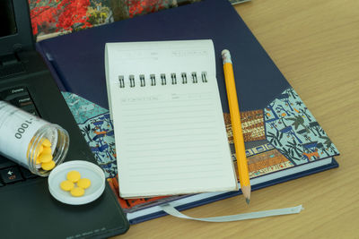 High angle view of open book on table