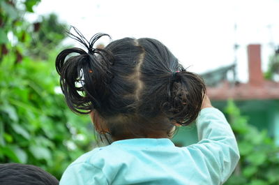 Rear view of woman with horse