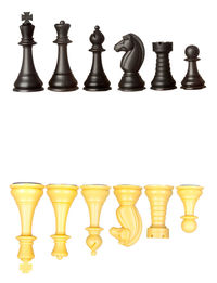 Close-up of chess board against white background