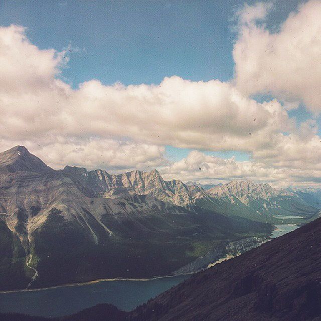 mountain, sky, tranquil scene, scenics, tranquility, mountain range, landscape, cloud - sky, beauty in nature, nature, cloudy, cloud, non-urban scene, physical geography, idyllic, remote, geology, day, outdoors, no people