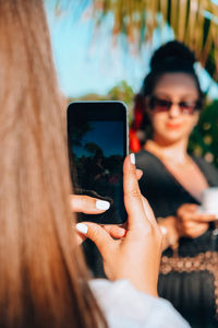 Young woman using mobile phone