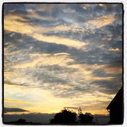 Scenic view of cloudy sky at sunset