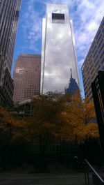 Low angle view of skyscrapers against sky during sunset