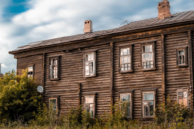 Low angle view of abandoned building against sky