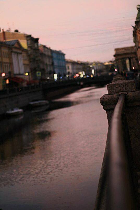 building exterior, architecture, built structure, city, illuminated, water, transportation, street, sunset, sky, canal, street light, dusk, road, river, car, city life, reflection, night, residential structure