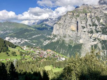 Scenic view of landscape and mountains against sky