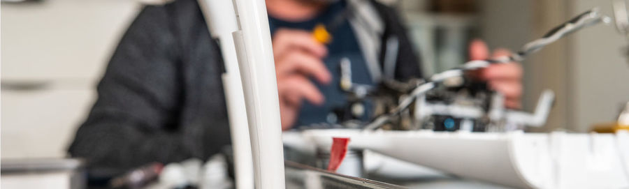 Close-up of person standing by railing