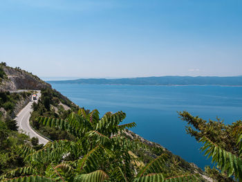 Scenic view of sea against clear blue sky
