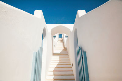 Low angle view of whitewashed stairway at santorini