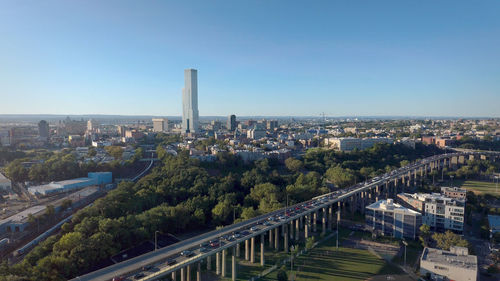 High angle view of buildings in city against clear sky