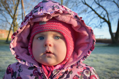 Close-up portrait of cute girl in winter