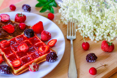 Close-up of strawberries in plate on table